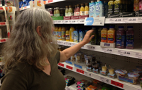 woman looking at groceries